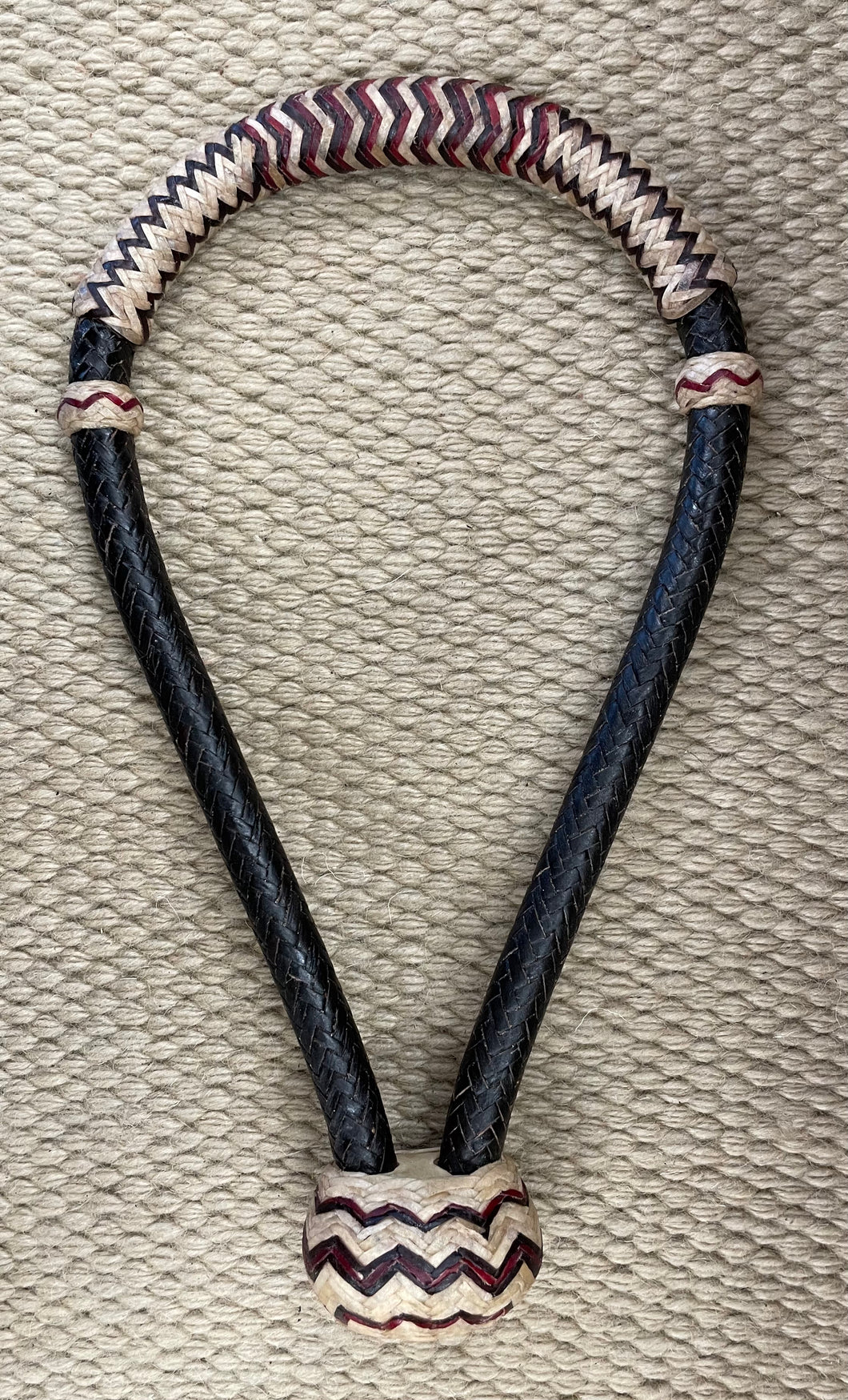 Bosal - B99 - 5/8” 16 Plait Black and Natural Rawhide w/ Red Accents