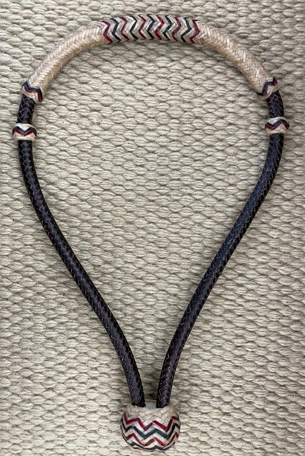 Bosal - B94 - 3/8” 12 Plait Latigo and Natural Rawhide Noseband w/ Black and Red Accents