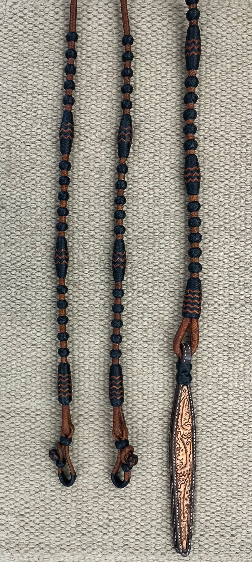 Romal Reins - RR22 - TRB 18 Plait George Moore Caramel w/ Black Knots and Accents 102